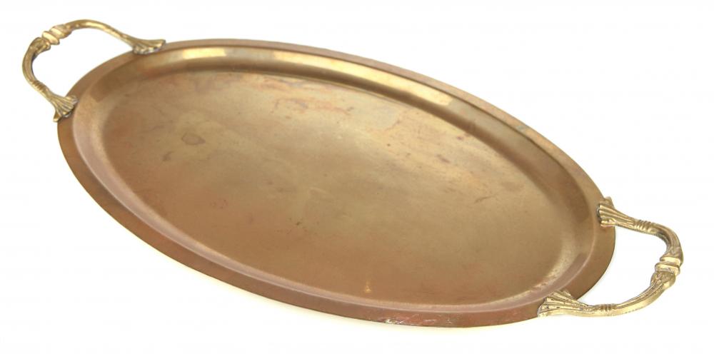 An antique brass serving tray.
