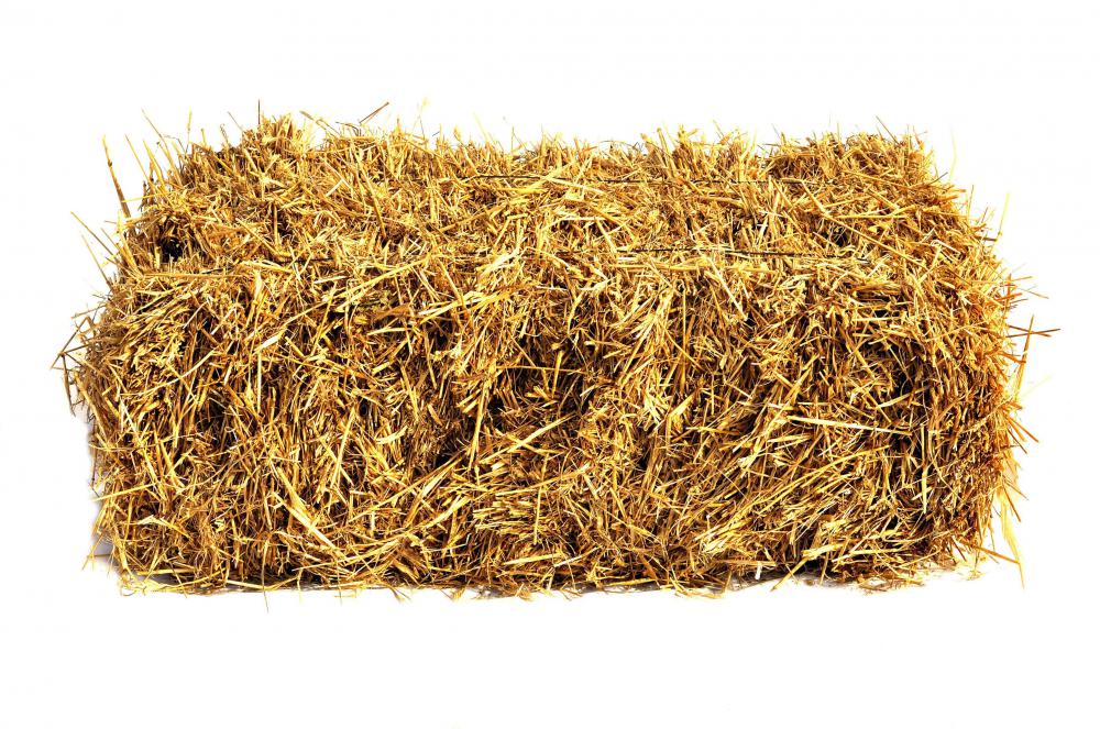 A bale of hay produced from a hay baler.