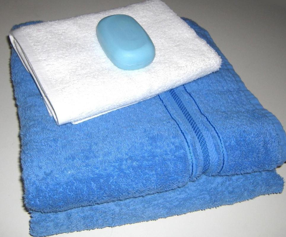 Most shower pans have built-in areas to hold soap, and bars to hold towels and other essentials.