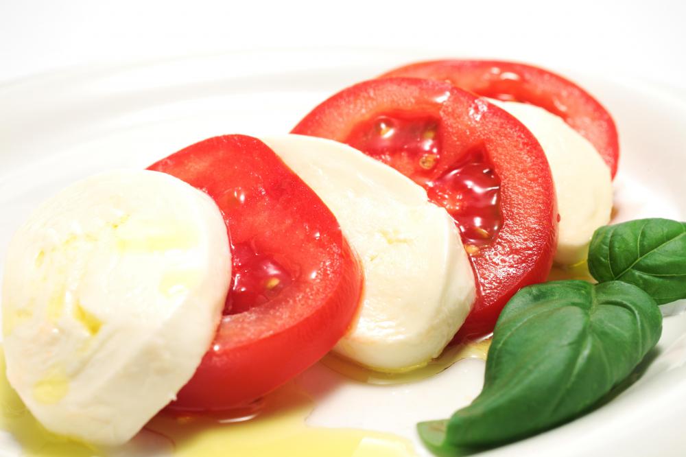 A caprese salad, which includes red tomatoes.