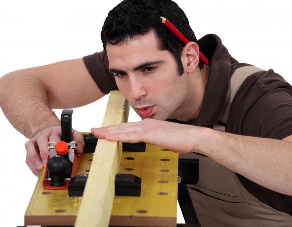 Carpenter working with a two by four.