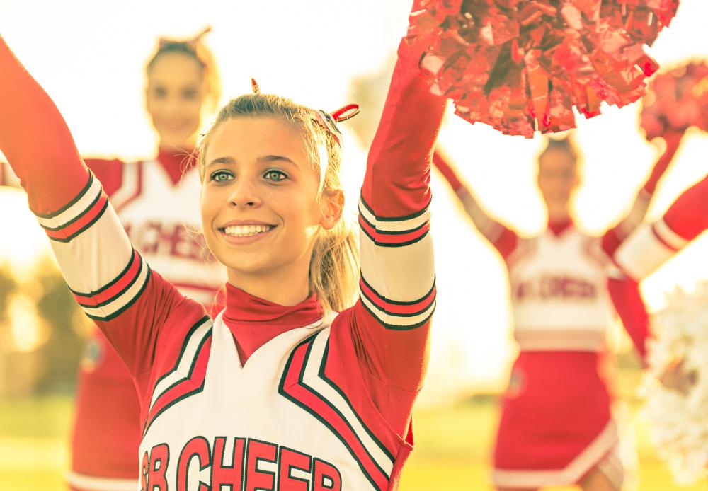 Cheerleaders can practice tumbling moves on a backyard trampoline.