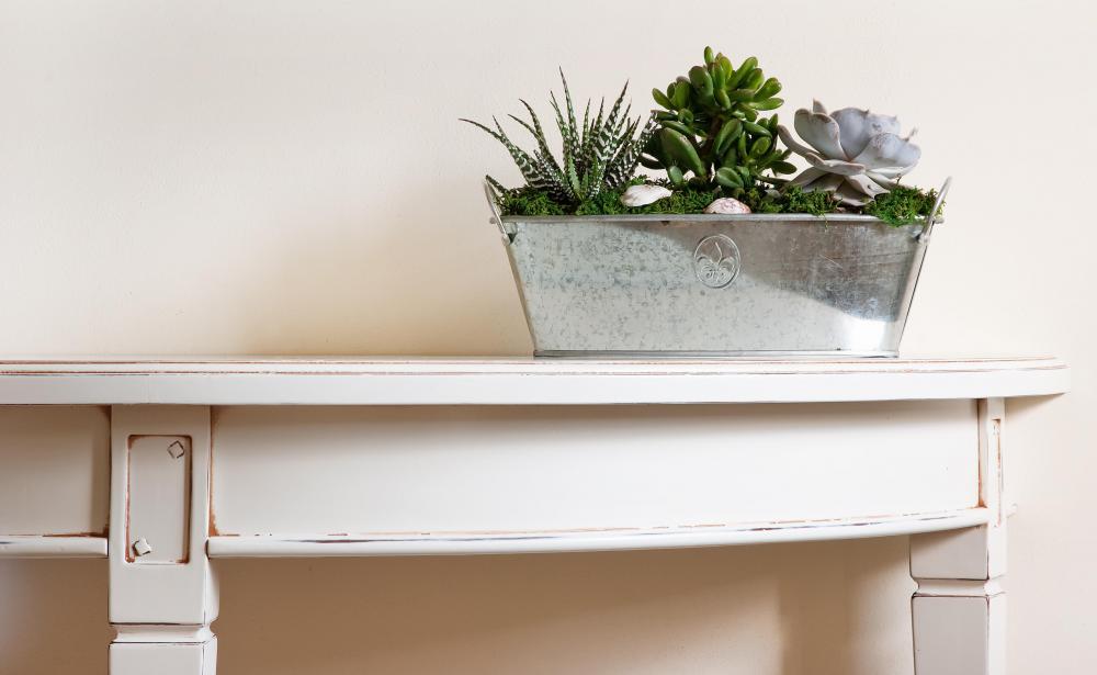 A console table is a table that either sits up against a wall or is attached to a wall.