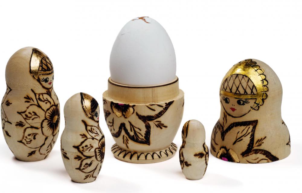 Designs are created in wood by using a heated poker or chisel.