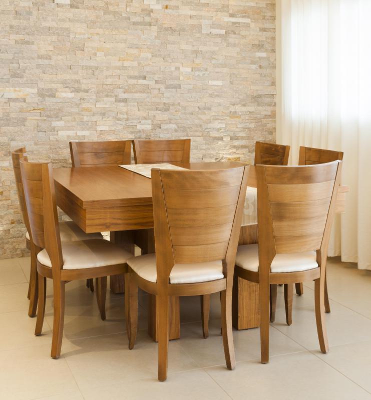 Some furniture, like a dining room table set, is made more attractive through the use of a veneer covering.