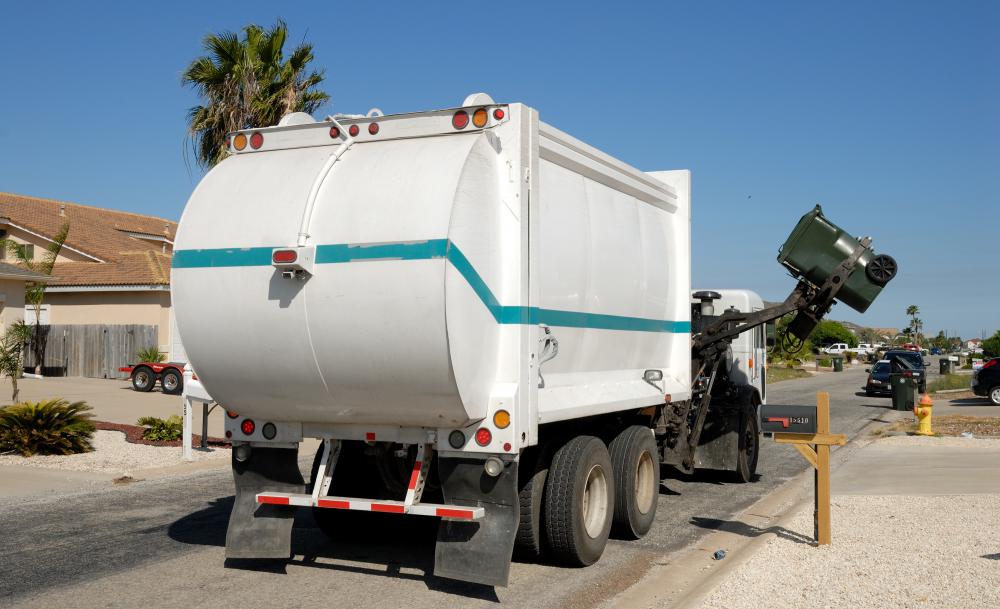 Small dumpsters are typically emptied straight into the truck bed of garbage trucks fitted with the appropriate collection arms.