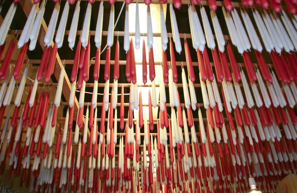 Taper candles are tall and thin; they are often made by dipping wicks in wax.