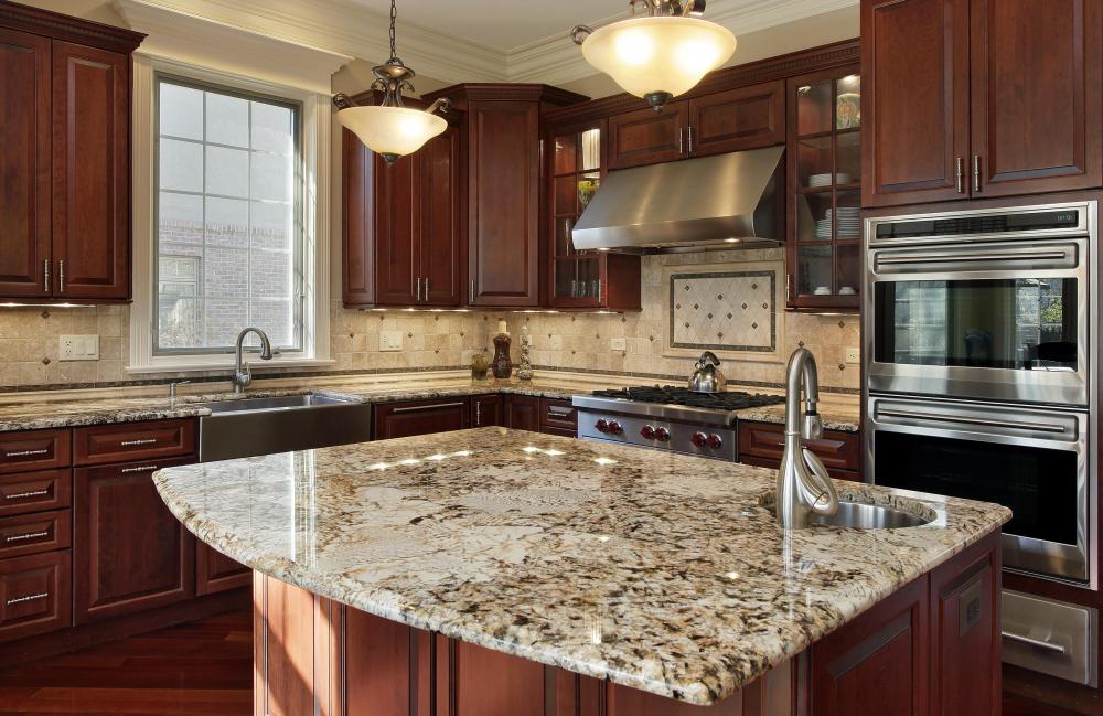 The smooth counter on a kitchen island makes it an ideal spot for placing hot dishes after cooking.