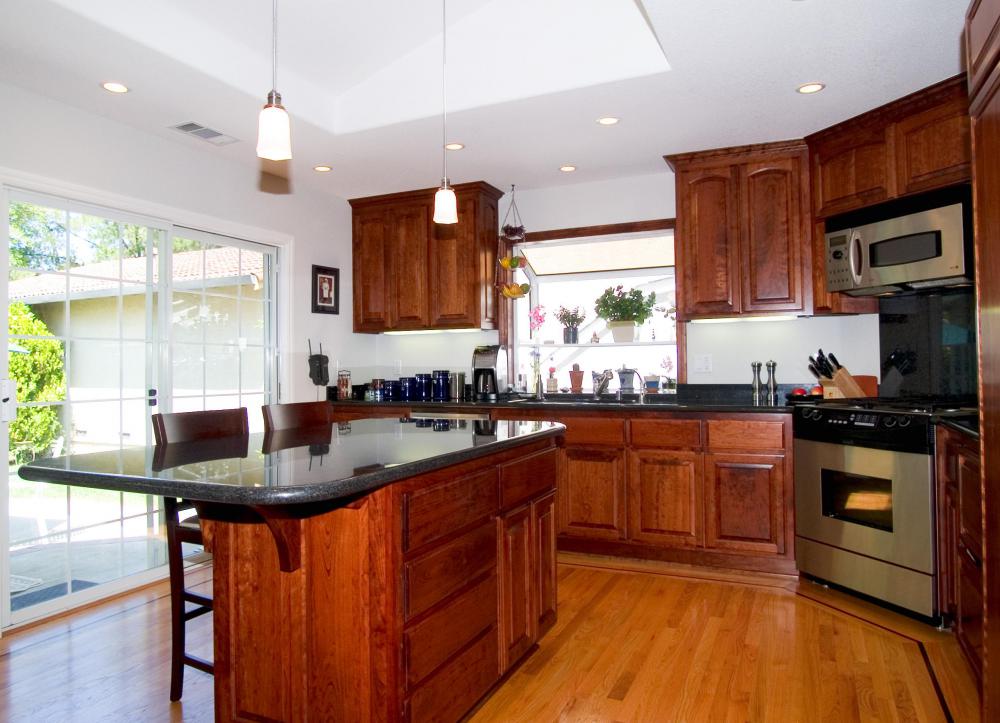 A kitchen island offers space to store pots and pans and a work area for food preparation.