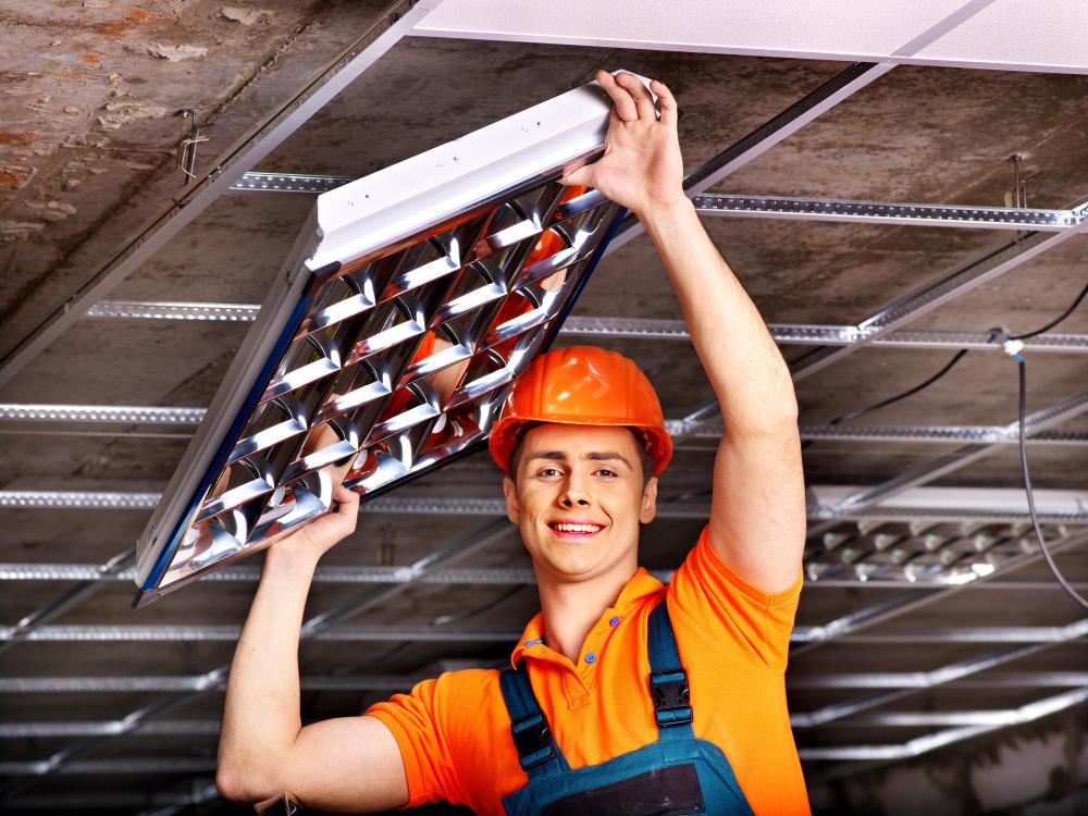 Man installing suspended ceiling.