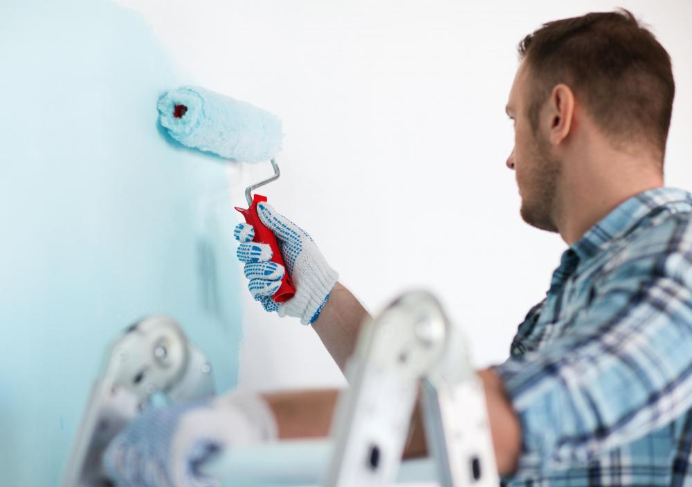 Professional house painters may be more convenient, since they carry out all the prep work in addition to painting.