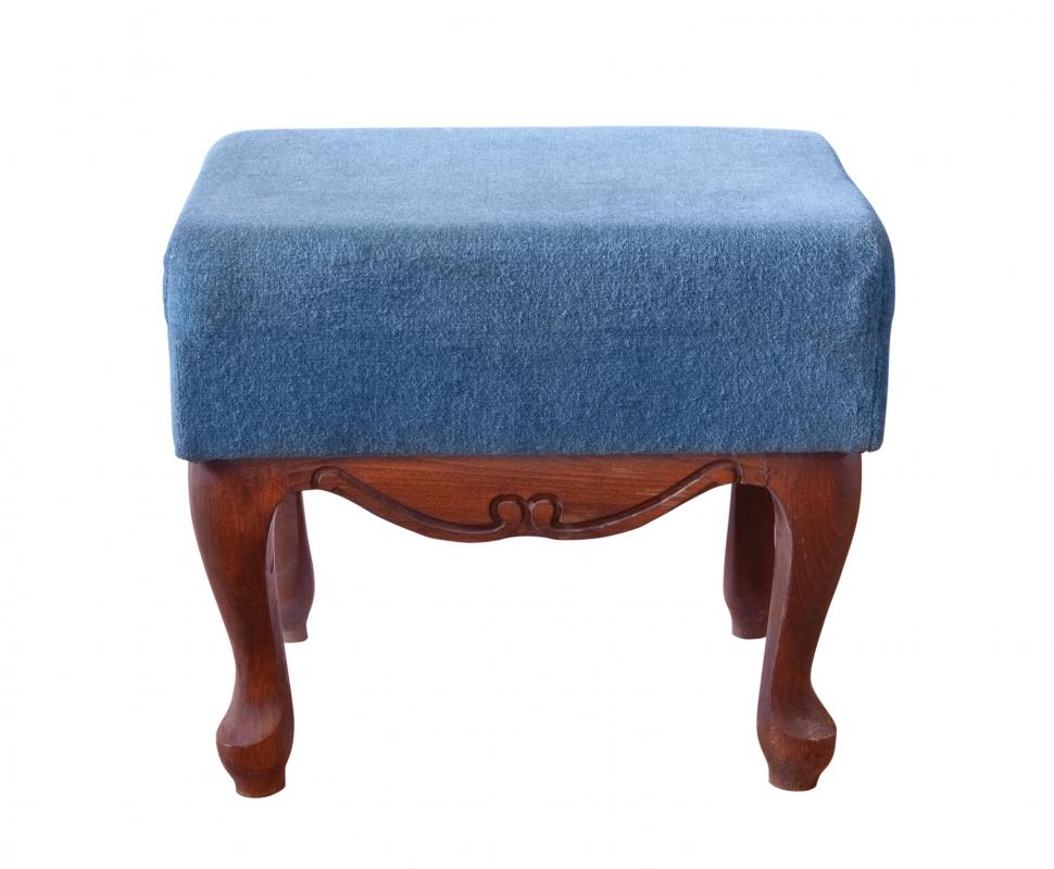 An upholstered footstool.