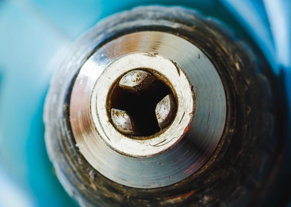 A chuck on a hand drill holds a bit shank in place.