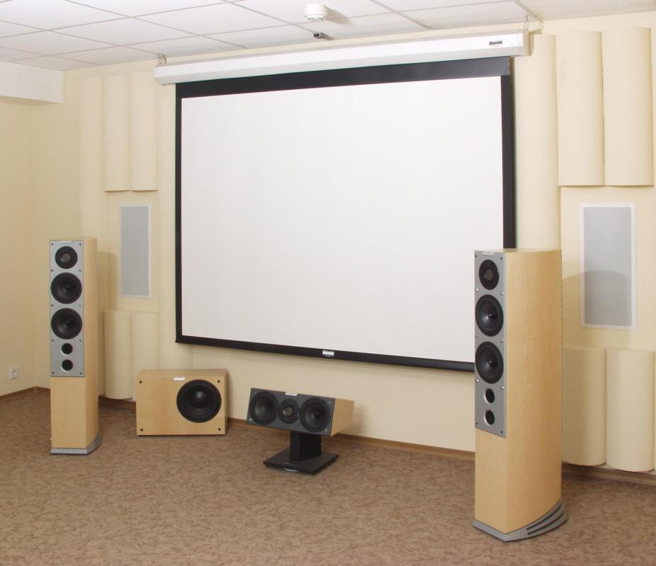 Soundproof curtains can be used to reduce outside sounds from coming into a home theater.