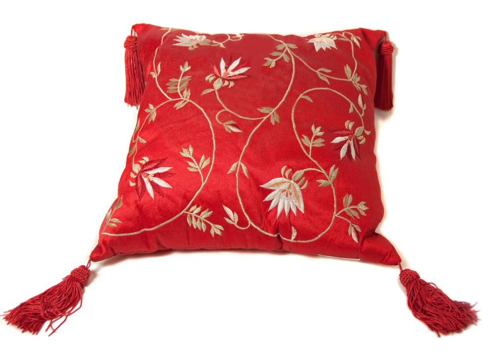 A throw pillow with tassels.