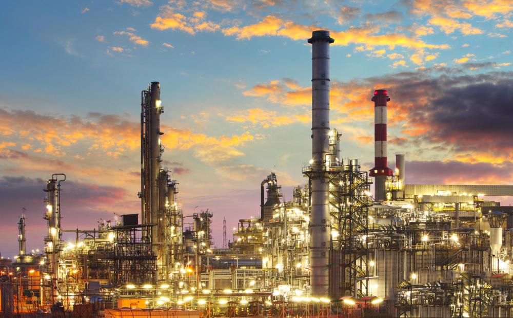Crude oil is separated into products like fuel oil, gasoline, and kerosene in cracking towers at oil refineries.