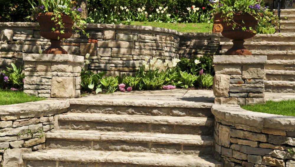 The footing of a retaining wall supports both the wall and the soil behind it.
