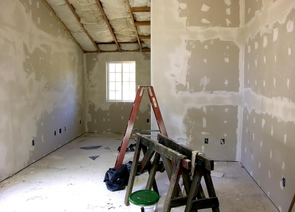 When used to create walls, drywall panels are hung from wall studs with screws and then taped and plastered over with joint compound where the panels meet.