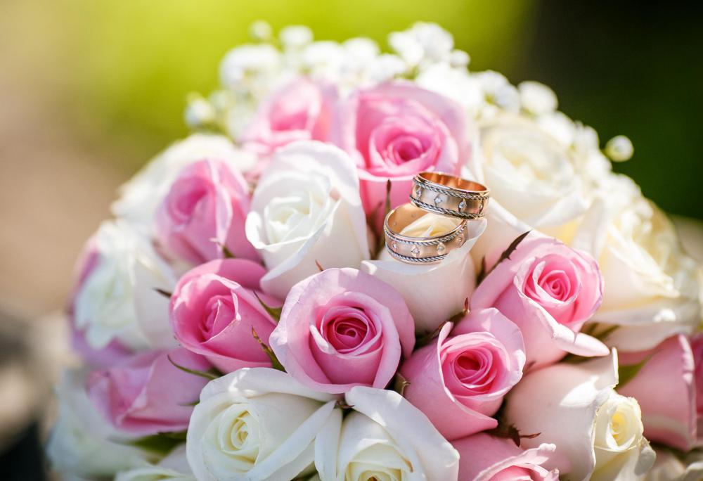 A bride may choose a rose bouquet for the wedding.