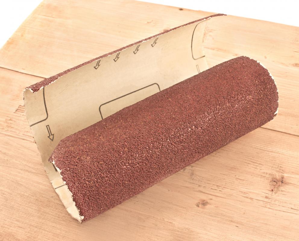 Sandpaper with coarse grit will remove too much material, no matter how lightly it is applied.