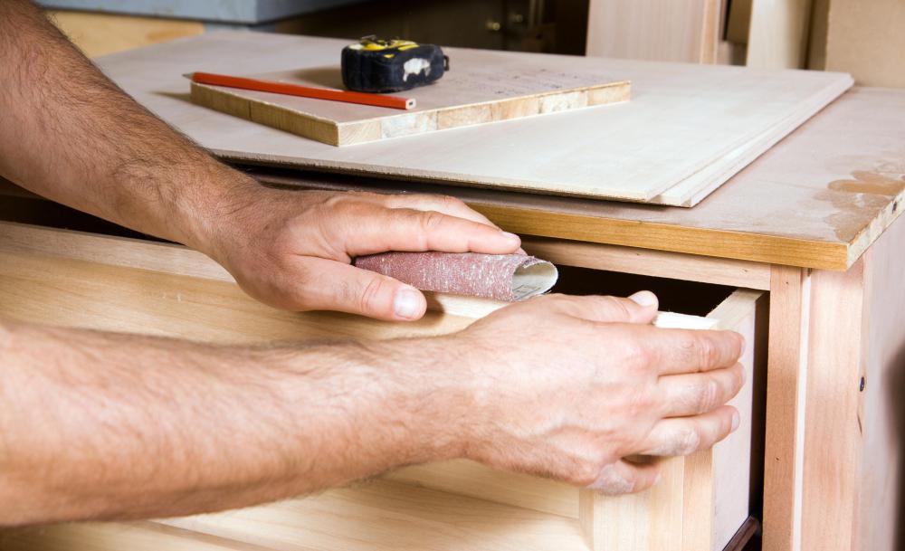 A carpenter may be hired to design and build a dresser.