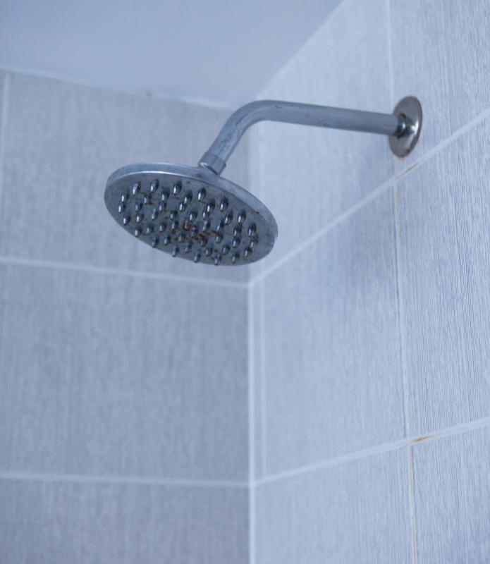 Wiping down glass doors after showering can help minimize hard water stains.