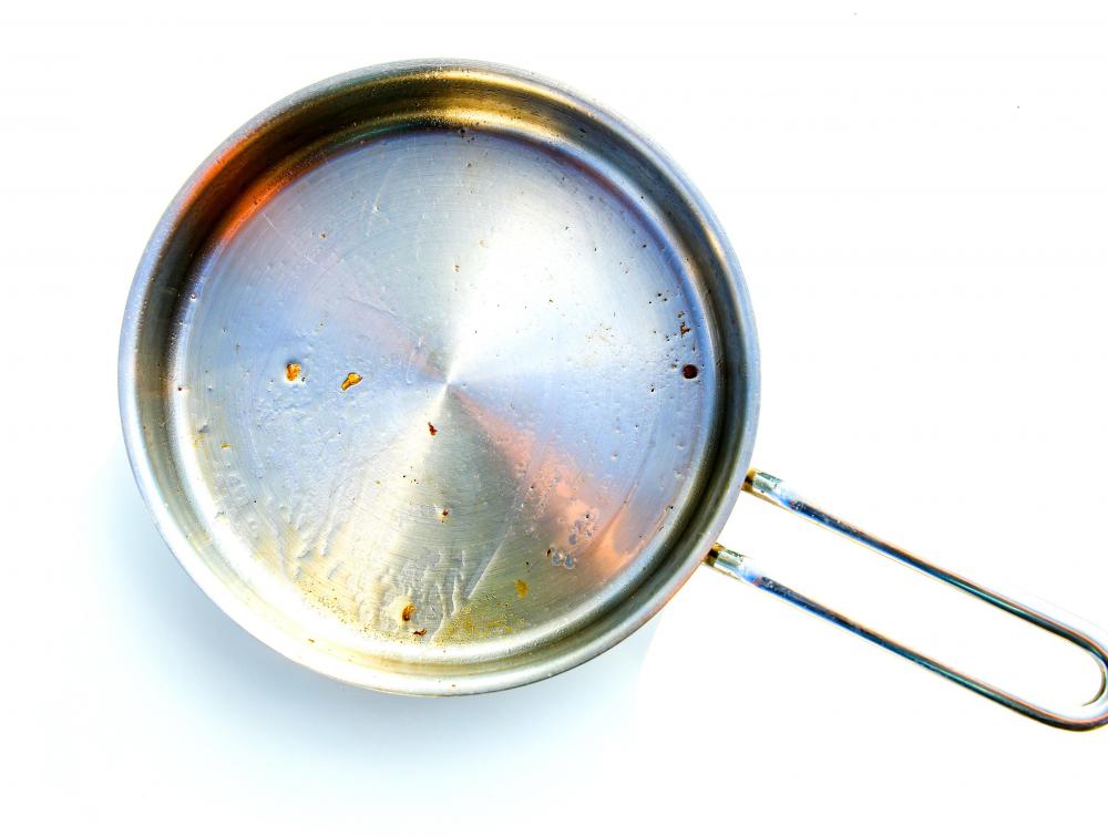 Hot water and mild detergent can clean stainless steel cookware.
