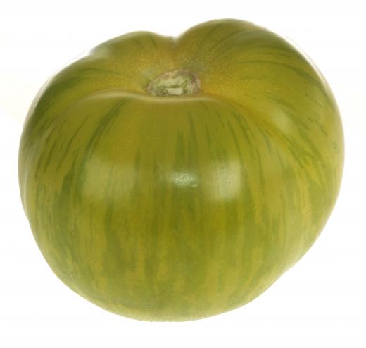 Green zebra tomatoes are characterized by green skin with yellow stripes and a tart flavor.
