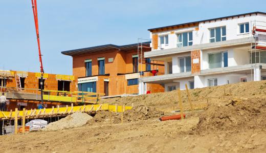 Suburbs can include apartments buildings, but often in smaller size and number than are found in a large urban city center.