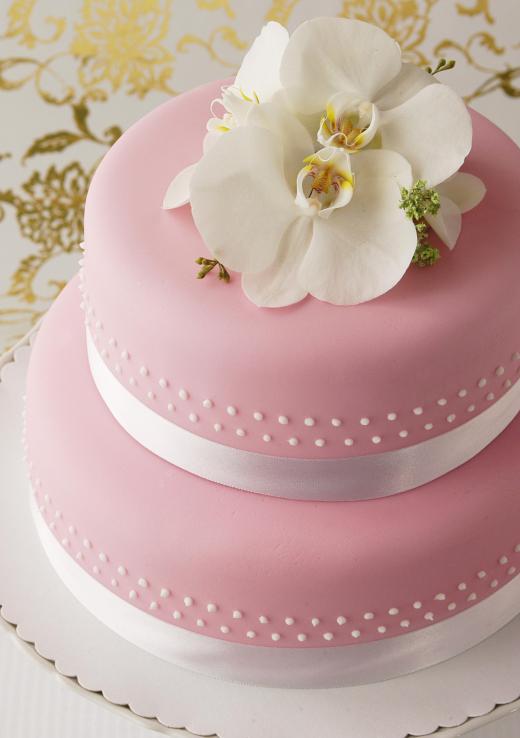 Ribbons and flowers of often used to decorate baby shower cakes when the mother is expecting a female child.