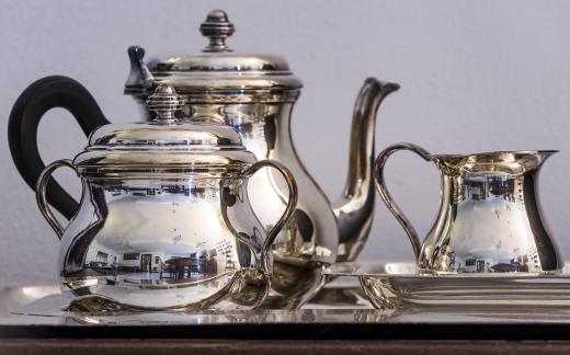 Tea towels can be spread over a tea tray before the tea set is put onto it.