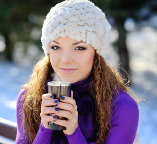A travel mug may be used to store hot chocolate.