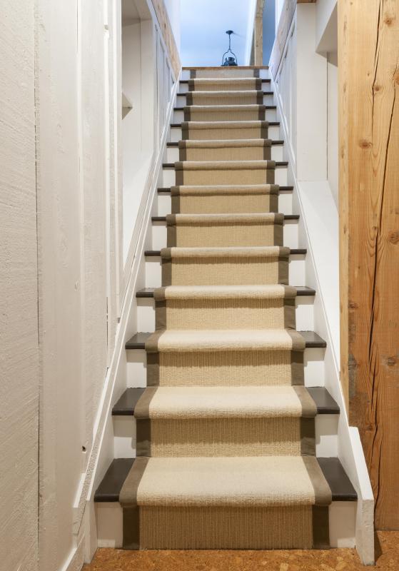 Skirting boards can be used to hide gaps between the staircase and the wall.