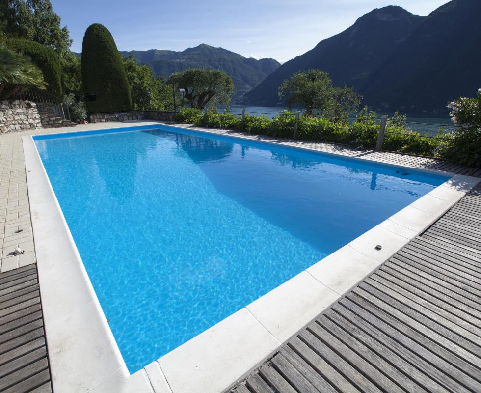 Paint with an epoxy compound should be used on wooden decks near pools because traditional paints may grow mold or mildew.