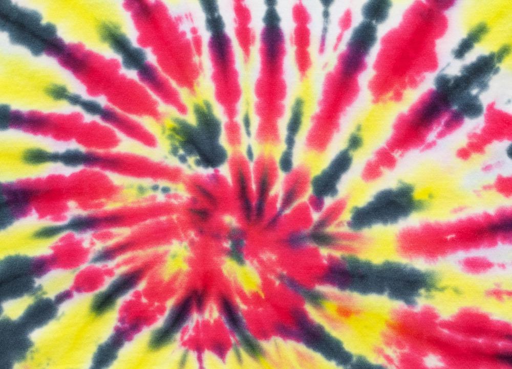 Shibori utilizes the tie-dye technique to create patterns.