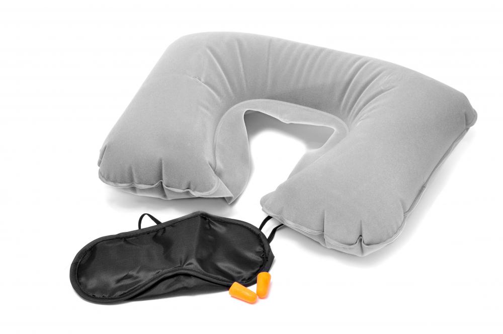 A travel pillow may help reduce neck pain during long, international flights.