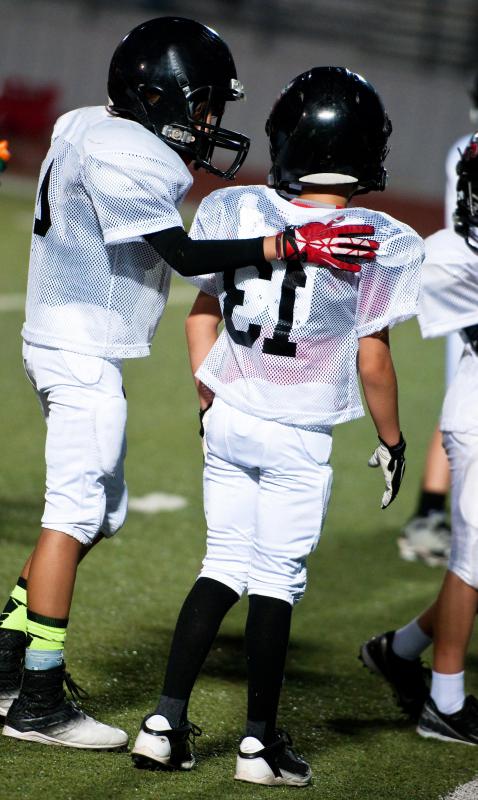 Acrylic socks may be part of the standard uniform for kids playing football.