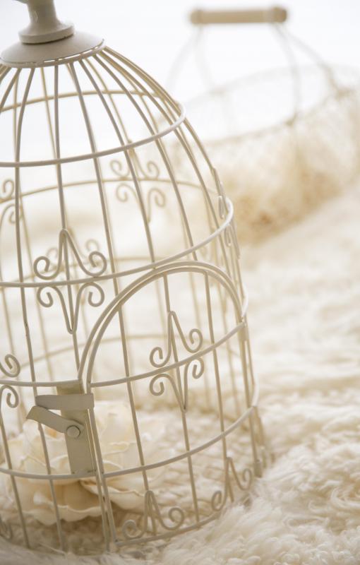 An ornamental birdcage fits with cottage style decorating.