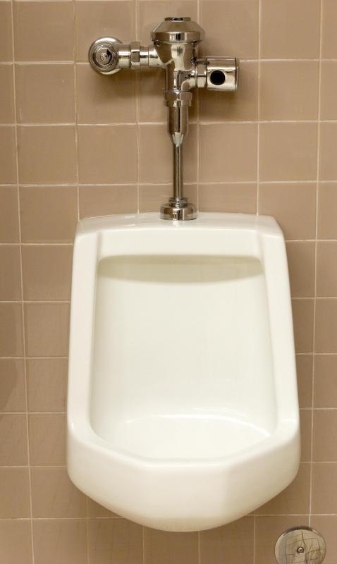 A flush valve is being replaced on some urinals by motion detectors.