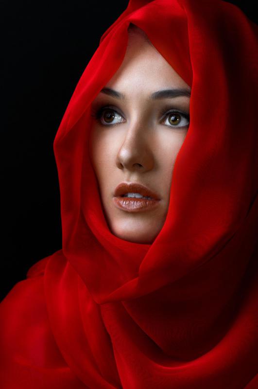 Woman wearing a silk scarf.