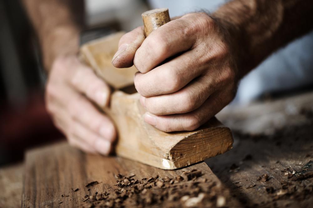 A planer is sometimes used on wood.