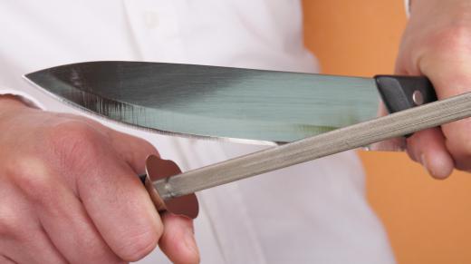 A knife sharpener, like a sharpening rod, can be used to sharpen scissors.