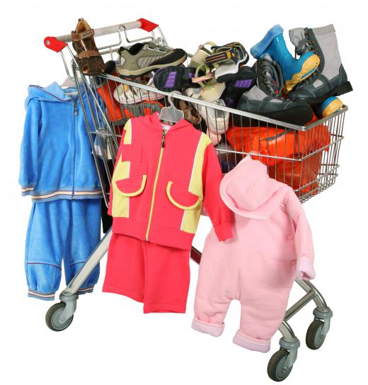 A shopping cart full of children's clothing, including some made of polyester yarn.