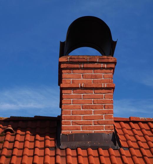 The chimney surrounds and provides insulation for the flue.