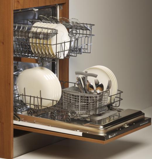 Built-in dishwashers are placed alongside kitchen cabinetry.