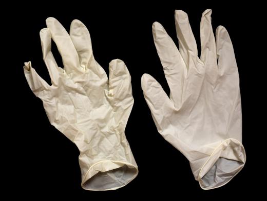 Wear disposable rubber gloves when handling a dishwasher heating element.