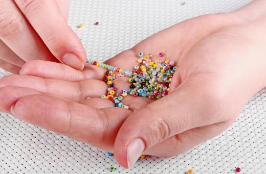 Beaded placemats have small beads creating simple patterns or complex designs.