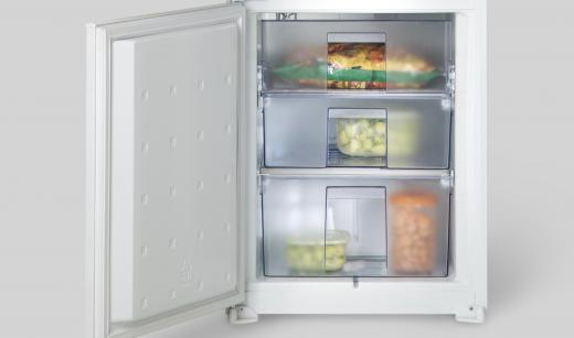 A compact refrigerator may have different drawers for keeping food items separate.