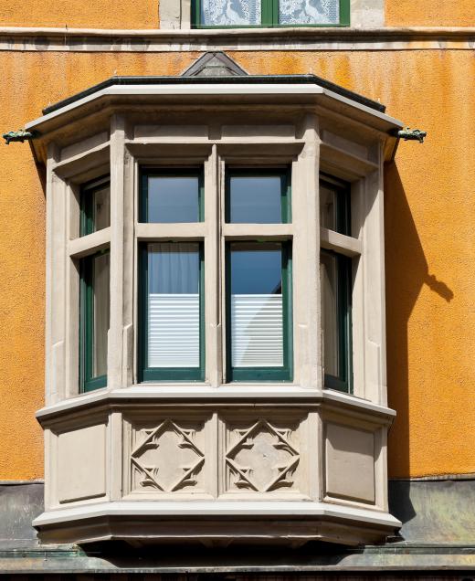 A Victorian carriage house may include bay windows.