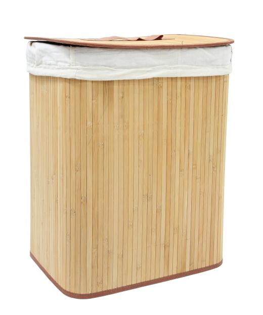 A clothes hamper showing vertical, rattan wood grain.